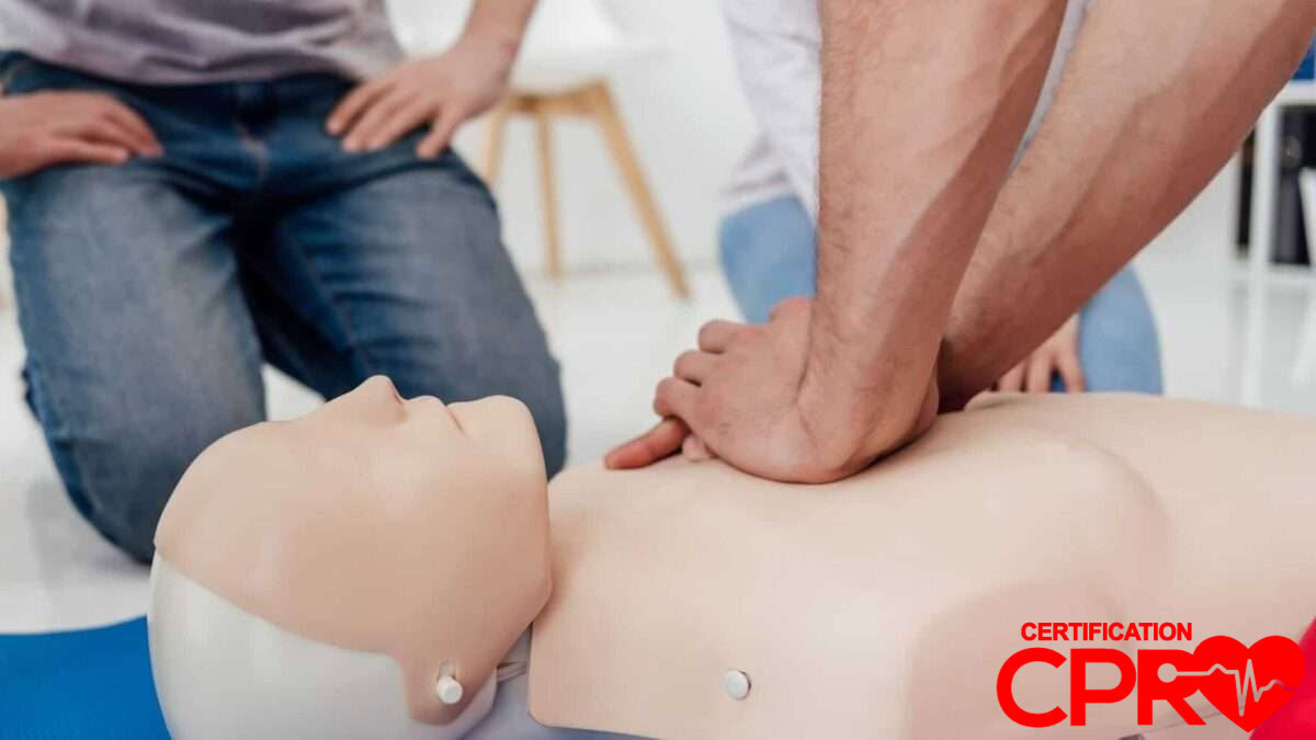 CPR training session with a man practicing on a mannequin in Clearwater.